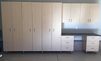 Maple cabinets, stainless steel legs and custom handles provided by the owner